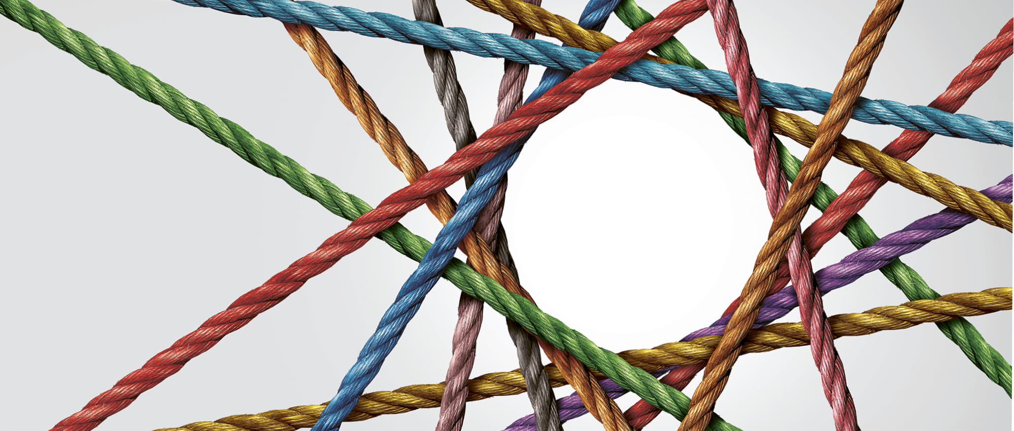 A net of different coloured ropes that form a circle in the middle. Copyright: iStock/wildpixe