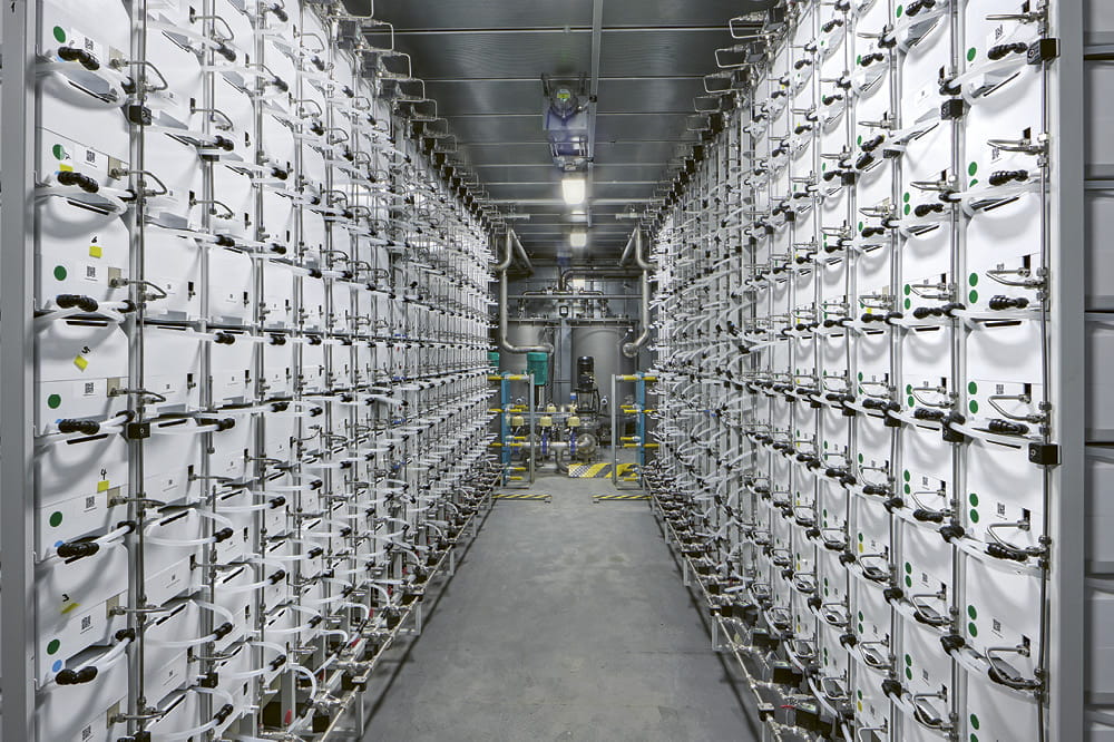 A hallway between containers. 