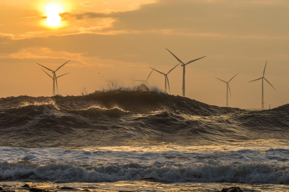 Offshore Windmill in sunset