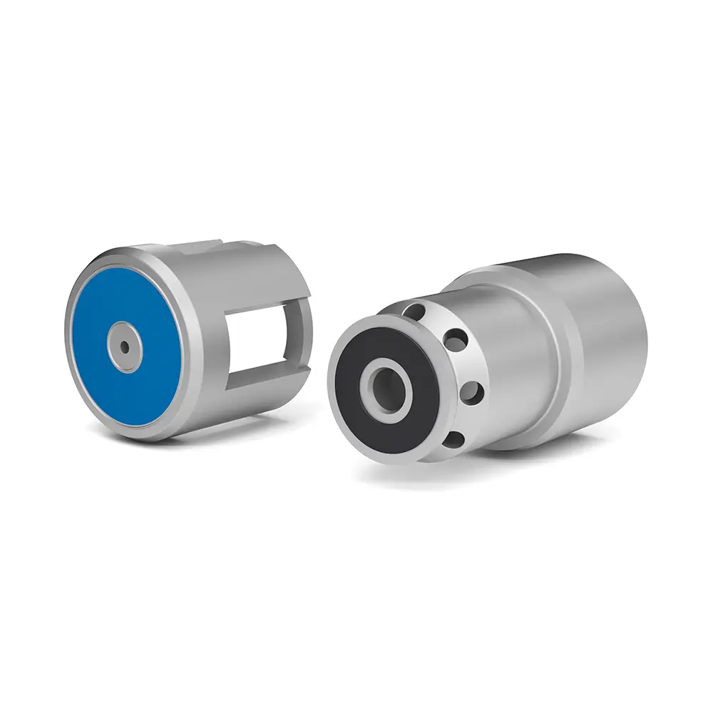 Two cylindrical mechanical components, one with a blue end cap and another with black circular holes, used as parts of a hydraulic or pneumatic system.